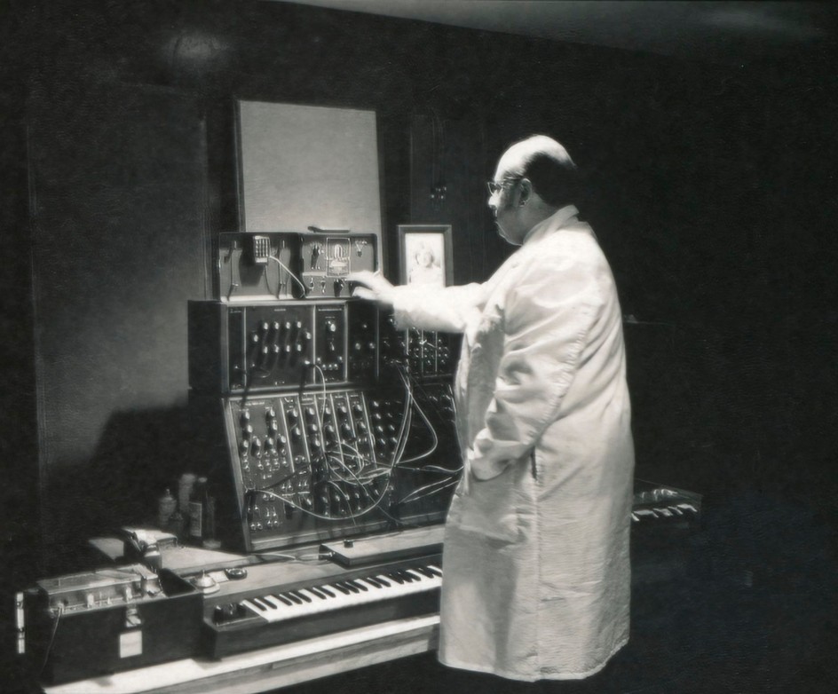 Jean-Jacques Perrey and his Moog modular synthesizer at his Carroll Music electronic music studio in New York City, late 1960s. Also visible are an Echoplex tape echo unit, a Conn Strobotuner and a framed photo of Perrey’s daughter Patricia.