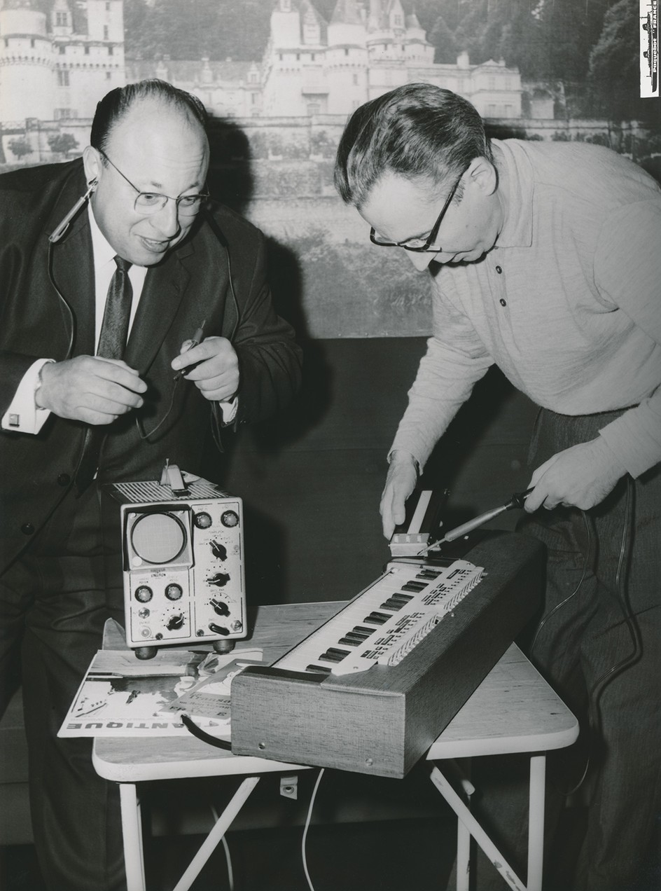Jean-Jacques Perrey and Ondioline inventor Georges Jenny aboard the S.S. France on their way to the NAMM (National Association of Music Merchants) exhibition in Chicago, June 1964.