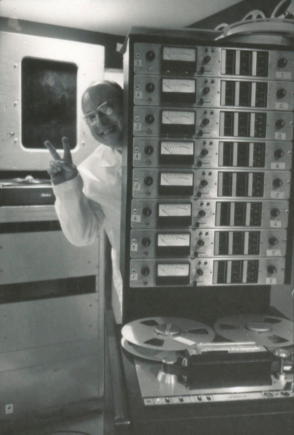 Jean-Jacques Perrey behind his Ampex 440 1” eight track tape machine in his electronic music studio at Carroll Music, New York City, late 1960s.
